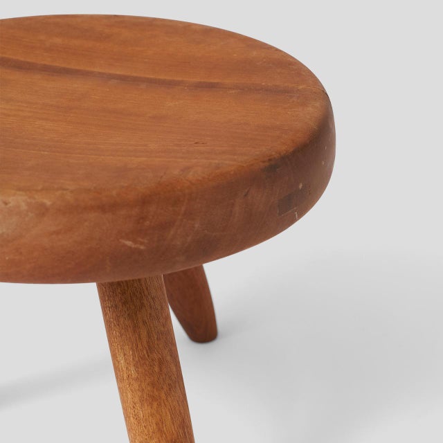 Description A Rare Low Stool by Charlotte Perriand A rare low stool in mahogany with three tapered legs by Charlotte...