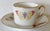 Beautiful Limoges cup and saucer decorated with a variety of moths and butterflies edged in gold.