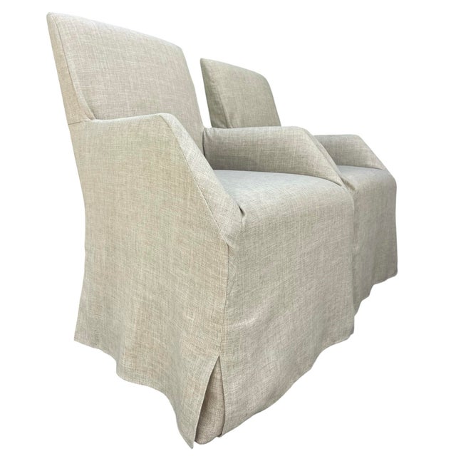 Elegant pair of Artistica Fiona upholstered arm chairs featuring tailored slipcovers in a versatile neutral linen-look...