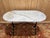 Authentic classic bistro table dating from the early 20th century. This piece combines the timeless elegance of veined...