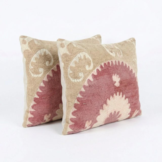 This beautiful 14'' x 22'' hand-embroidered Suzani pillow cover set was made from authentic Uzbek cotton fabric. The...