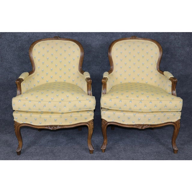 This is a clean pair of French Louis XV Style Bergere chairs in good condition with bright yellow upholstery with charming...