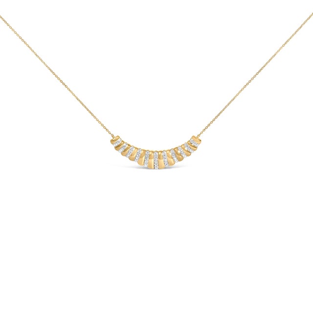An ode to modern radiance, this curved, fan-like bar pendant unfurls in bold ribbed segments that catch every flicker of...