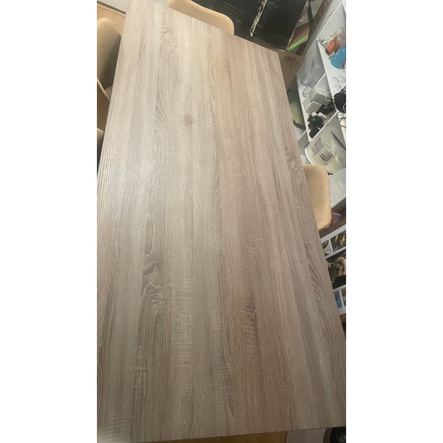 A dining table purchased for my first apartment that turned out to be too big for the space. However, I took up space for...