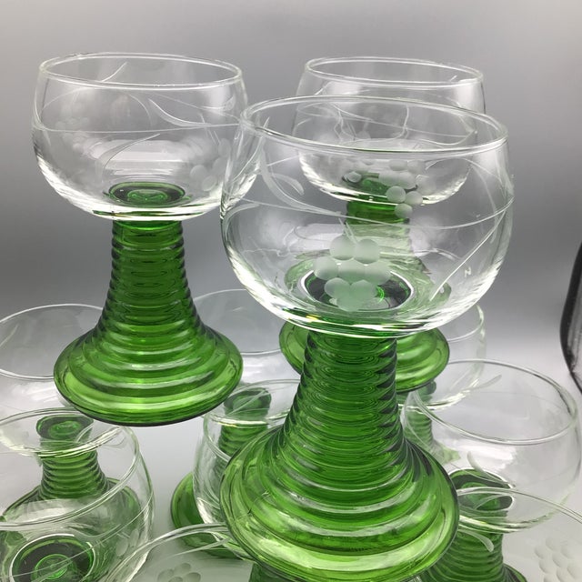 https://chairish-prod.freetls.fastly.net/image/product/sized/740ca59c-38ea-46f4-b3b2-25e122dcb0c1/vintage-german-roemer-emerald-green-closed-bee-hive-stem-etched-bowl-wine-glasses-set-of-11-0189?aspect=fit&width=640&height=640