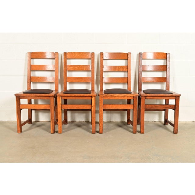 A beautiful set of four antique Mission or Arts & Crafts ladder back dining chairs By Charles P. Limbert Co. USA, Circa...