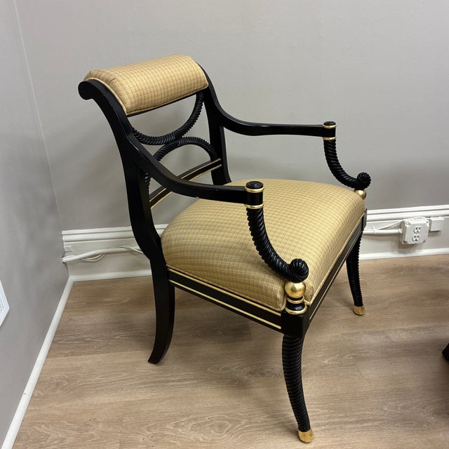 Restored Black and Gilded Gold Leaf Accents Regency Arm Chairs. Made by Century Furniture with new matching custom upholstery