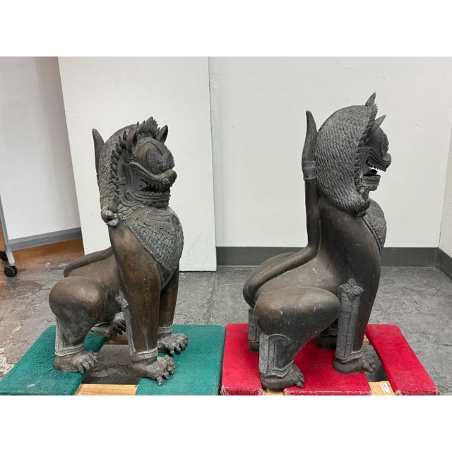 Design Plus Gallery presents a Vintage Set of Singha Guardian Lion Sculptures. Each cast metal figure depicts a mythical...
