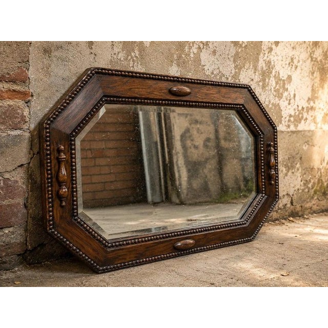 A beautiful and unusual antique Edwardian octagonal wall mirror, dating to the early 20th century and featuring a richly...