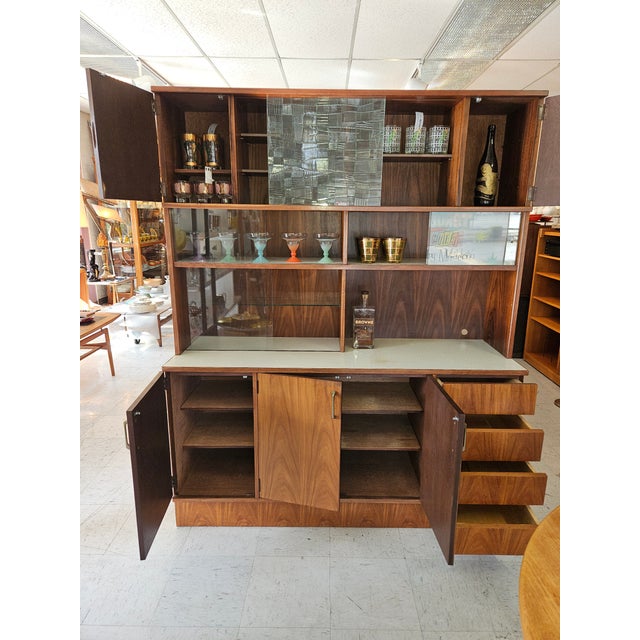Elevate your living space with this breathtaking Mid-Century Modern Japanese Teak Masterpiece. This isn't just a hutch;...