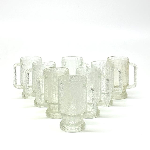 Clear textured glasses, set of 8. A stunning set of Indiana Glass "Crystal Ice" textured glass-handled mugs that are...
