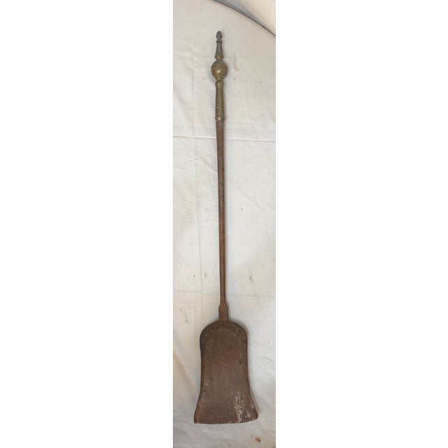 Up for sale is a rare antique 18th century wrought iron and brass English fireplace shovel. The shaft and blade are...