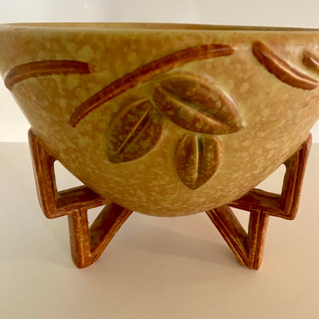 A striking example of American Art Deco ceramics, this vintage Weller Goldenglow tripod bowl dates to the 1930s and...