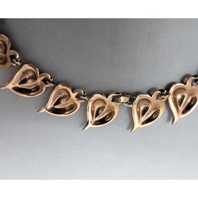 Rare 1938 goldtone heart shaped leaf link necklace with fold over clasp. Marked crown "TRIFARI" on the back of the leaf...