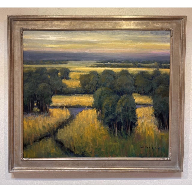 In "Open View," expansive fields stretch beneath a moody sky, capturing the tranquil beauty of a rural landscape. The...