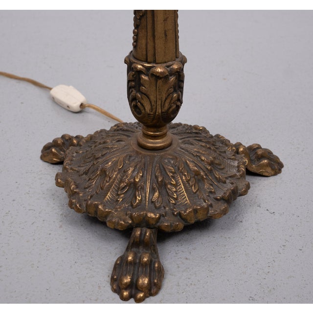 Very nice Classic Floor lamp. Brass Rococo style feet, green Metal upright and comes with a Stone Red Velvet shade . Very...