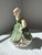 The Royal Doulton Figurine "Fair Maiden" HN 2211 is an English bone china figure produced by Royal Doulton, issued in the...