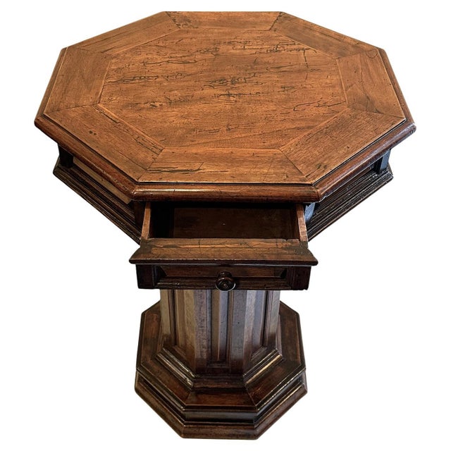Renaissance Revival, Tuscan, walnut octagonal table with a drawer. Wooden knob on drawer.