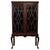 An elegant early 20th-century English display cabinet, finely crafted from mahogany and distinguished by its graceful...