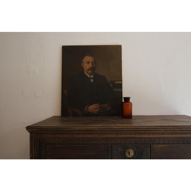 A highly decorative original German apothecary glass jar. Circa 1920´s/ 1930`s. The bottle made of amber glass, fitted...