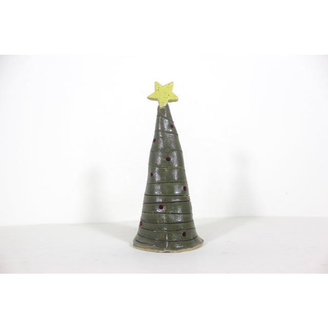 Vintage handmade pottery Christmas tree tea light candleholder. There are holes in the sides, so the light shines out when...