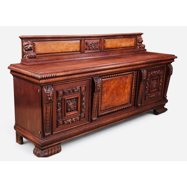 An impressive architectural statement, this monumental 20th-century credenza combines richly carved ornament with luminous...