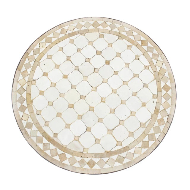 Traditional handmade beige and white round mosaic tile side table with black iron edge. Great for outdoor or indoor use....