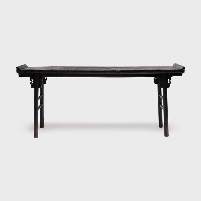 In households throughout China, long tables with everted ends were commonly placed against the back wall of the main room...