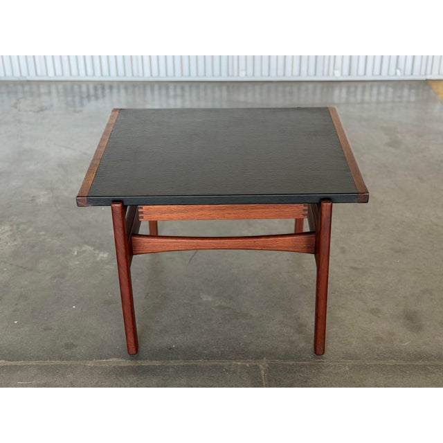 Jens Risom leather and walnut side or end table. Seldom seen example from Risom Designs. One small drawer with exposed...