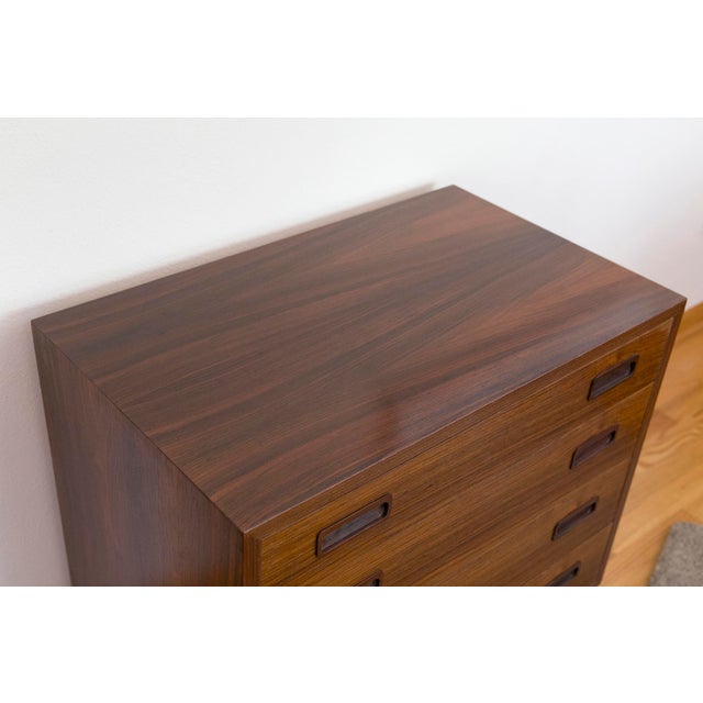 This 4-drawer chest is a well-maintained mid-century Danish modern piece from furniture designer Hundevad & Co. It was...