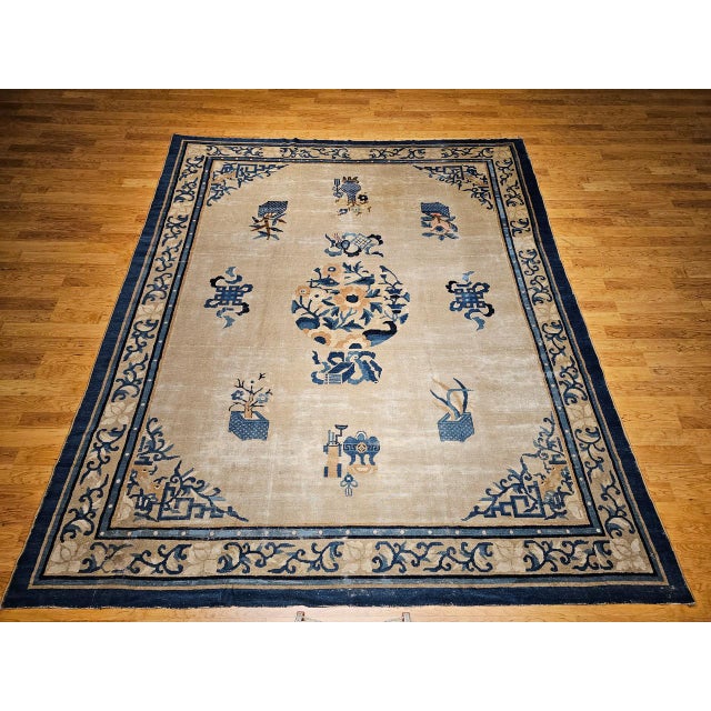 This exceptional Chinese Peking rug from the 4th quarter of the 1800s is a rare find—especially in its near-square shape,...