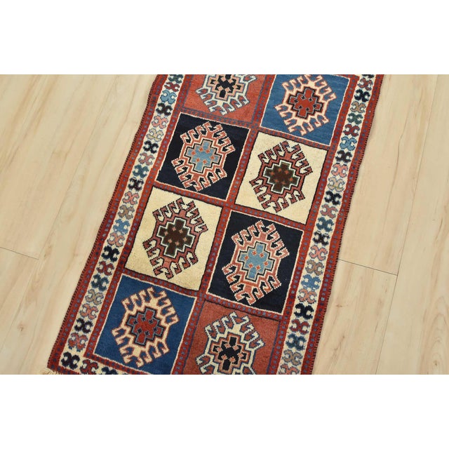 An authentic vintage tribal Yalameh rug hand-knotted with fine wool and natural dyes. This finely woven nomadic rug...