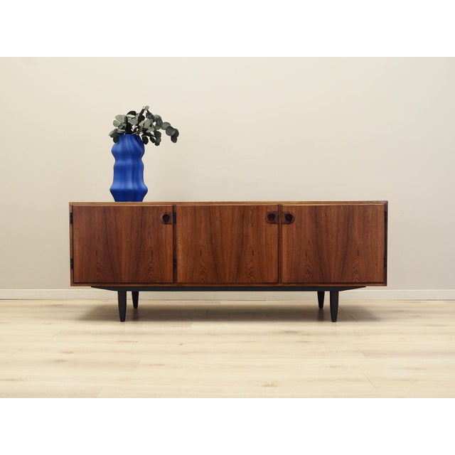 The sideboard was made in the 1960s, designed by leading Danish designer Svend Langkilde. The structure is covered with...
