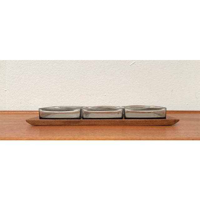 Mid-Century Danish Tray in Teak with Cabaret Glass Trays from Holmegaard, 1960s, Set of 4, in Very Good conditions....