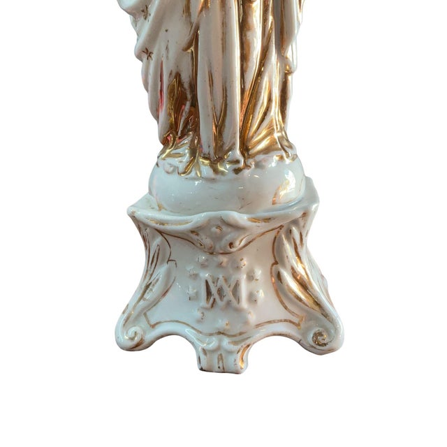 Beautiful antique French Vieux Paris porcelain Madonna and Child. It features hand-painted details and gilt accents on a...