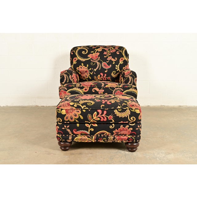 An elegant club chair or lounge chair with ottoman in paisley upholstery By Smith Brothers of Berne USA, Circa Late 20th...