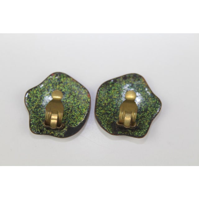 Earclips made of enamel, partly underlaid with leaf silver. ca. 10g This piece has an attribution mark, I am sure that it...