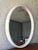 A stylish circular wall mirror finished in faux shagreen. The textured surface and refined organic finish are reminiscent...