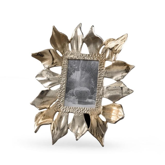 Display your favorite memory in this nature inspired accent that complements any decor. Inspired by the petals of the...