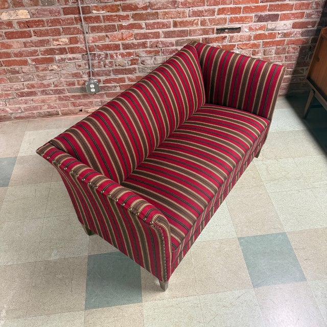Compact 1950s-60s Danish two-seat sofa upholstered in original Gabriel Savak attributed striped wool. The sofa has a...