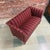 Compact 1950s-60s Danish two-seat sofa upholstered in original Gabriel Savak attributed striped wool. The sofa has a...