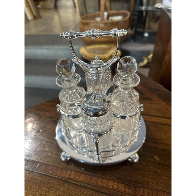 English Sheffield Oval Cruet in Excellent with Four Engraved Glass Bottles, Set of 5, in Flawless conditions. Designed...