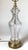 An elegant pair of cut crystal lamps with brass bases. The urn shape with vertical cuts on the body with a brass base....