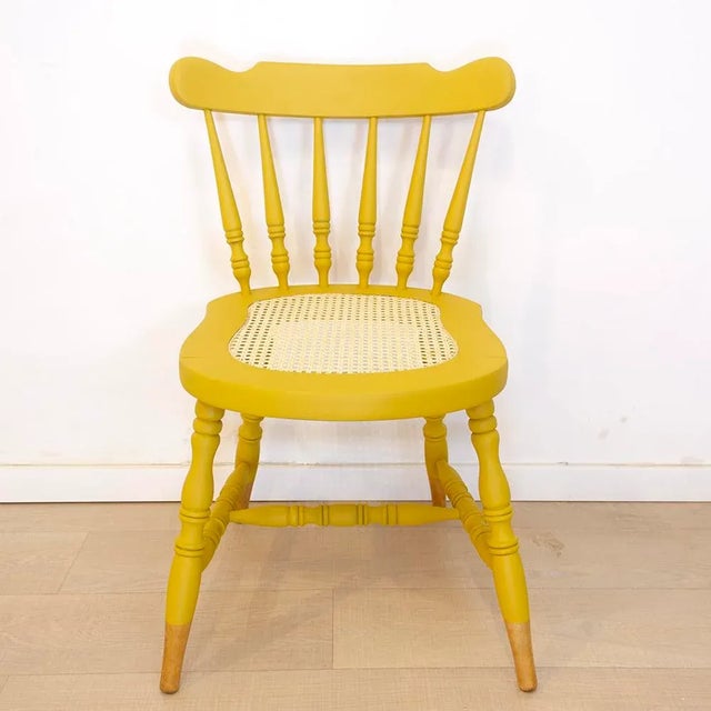 Oak wooden chair with wicker grid seat. Completely restored with new grid in the seat and painted mustard in Dip-DyE inverse.