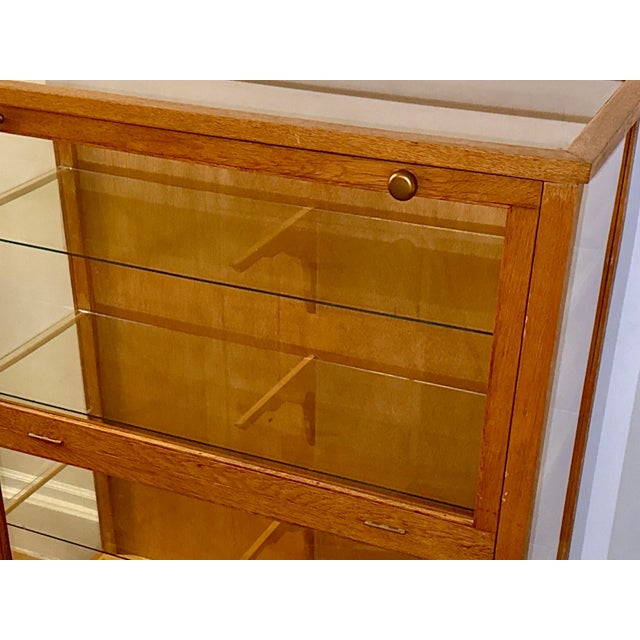 Antique Tiger Oak & Glass Display Case – Fold-Down Front with Glass Shelves 32”W × 14”D × 42”H A beautifully preserved...
