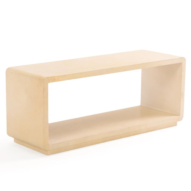 This versatile parchment-covered piece functions beautifully as a low coffee table, a minimalist bench, or a sleek media...