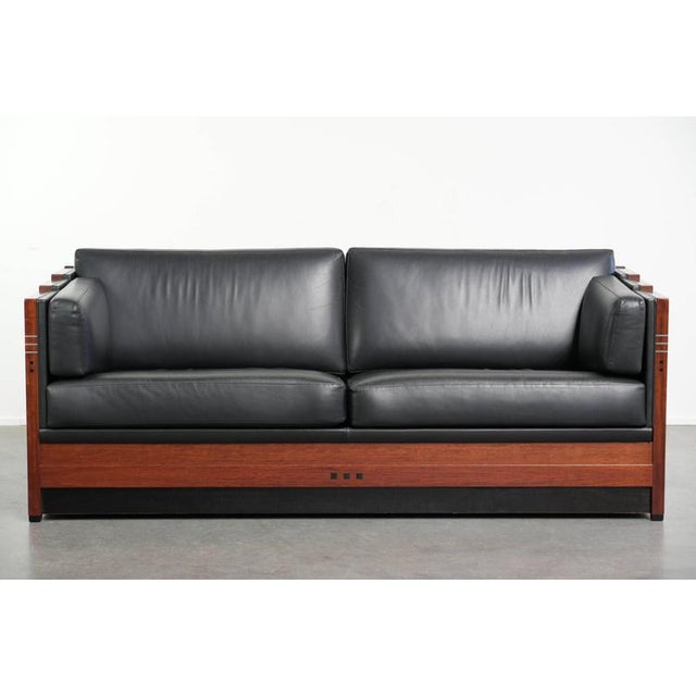 Luxurious set of 2 top-quality black cowhide leather and wood Schuitema Art Deco design 3-seater sofas. : This luxurious...
