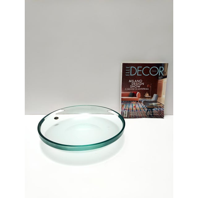 Made in Italy, 1960s. This vide-poche / centerpiece is made in thick and heavy Nile green curved and beveled glass. It is...