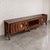 A sculptural walnut integrated stereo console combining exceptional furniture craftsmanship with high-performance Klipsch...