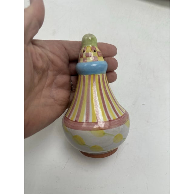 This is a delightful MacKenzie-Childs salt and pepper shaker set that exudes the brand’s signature whimsical style: •...